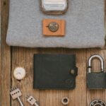 Map - Gray Shirt and Leather Wallet on Wooden Surface