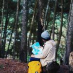 Hiking Trail Maps - Woman Wearing Blue Knit Cap