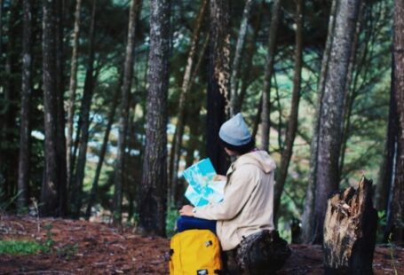 Hiking Trail Maps - Woman Wearing Blue Knit Cap