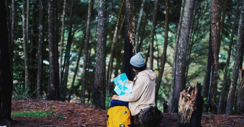 Hiking Trail Maps - Woman Wearing Blue Knit Cap
