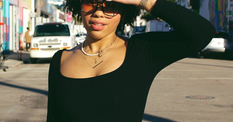 Shading - A woman in jeans and a black top is standing on the street