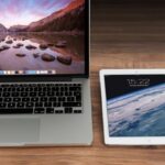 Digital Technology - Macbook Pro Beside White Ipad