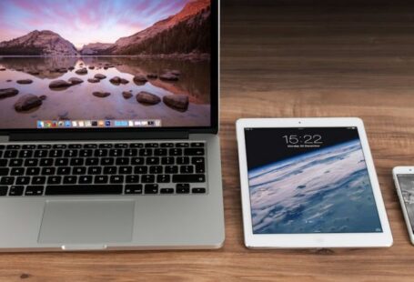 Digital Technology - Macbook Pro Beside White Ipad