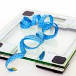 Scale - Blue Tape Measuring on Clear Glass Square Weighing Scale
