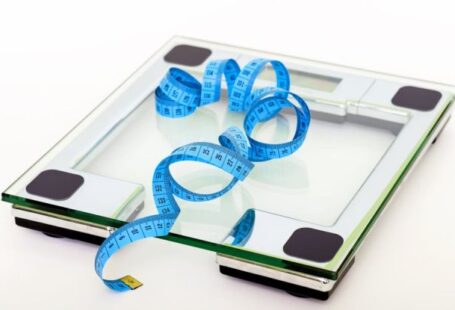 Scale - Blue Tape Measuring on Clear Glass Square Weighing Scale
