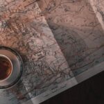 Thematic Maps - White Ceramic Cup on Map