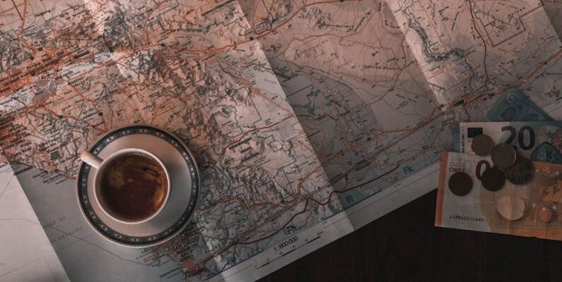 Thematic Maps - White Ceramic Cup on Map