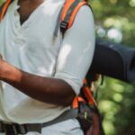 GPS Device - Crop hiker with smartphone in forest