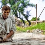 Survival Navigation Skills - Elderly Man Working with Wooden Sticks