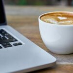 Courses - Teacup of Latte Beside Macbook Pro