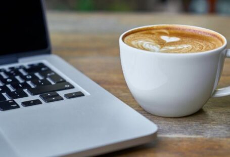 Courses - Teacup of Latte Beside Macbook Pro
