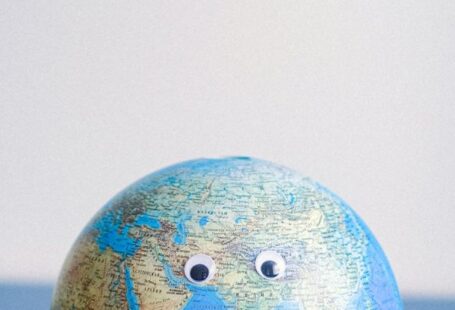 Cartography - Sphere shaped miniature of Earth with googly eyes