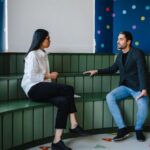 Educators - Man and a Woman Having a Conversation inside a Classroom