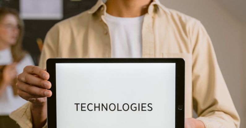 Geospatial Technologies - A Man Holding a Digital Tablet